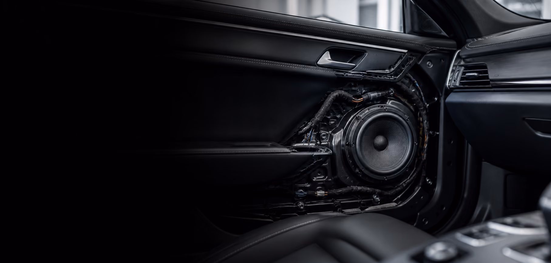 Speaker and audio installation detail in a modern car interior